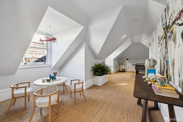 interior space with lofted ceiling and light carpet