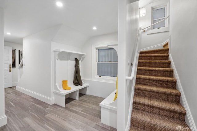 stairway with wood-type flooring