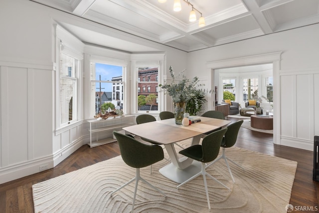 dining area featuring beam ceiling, crown molding, dark wood-type flooring, and coffered ceiling