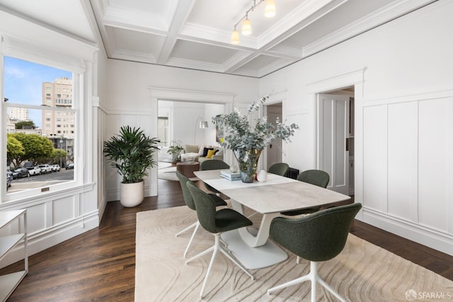 dining area featuring beamed ceiling, dark wood-type flooring, crown molding, and coffered ceiling