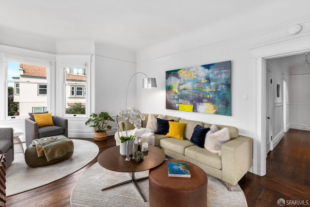 living room featuring dark hardwood / wood-style flooring and an inviting chandelier