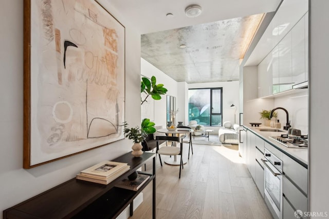 bathroom with wood-type flooring and vanity