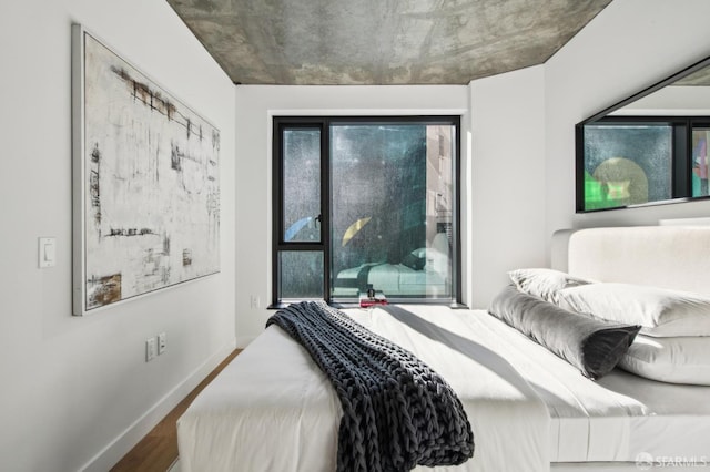 bedroom with wood-type flooring