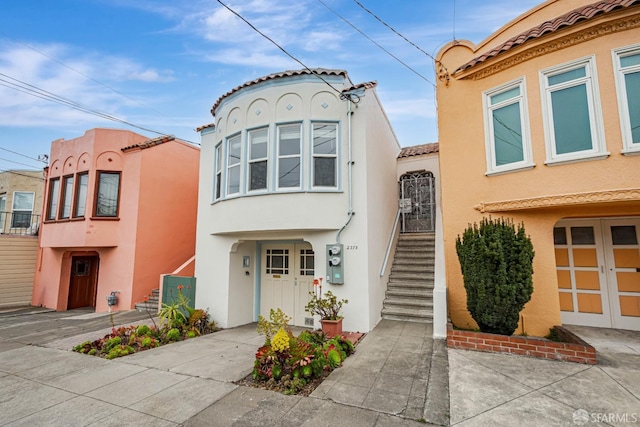2375 31st Ave, San Francisco, CA 94116 - view of front of house featuring stucco siding and a tile roof