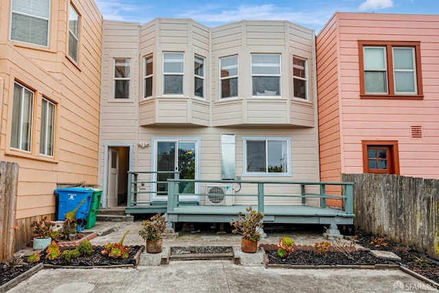 2375 31st Ave, San Francisco, CA 94116 - rear view of house featuring fence, ac unit, and a deck