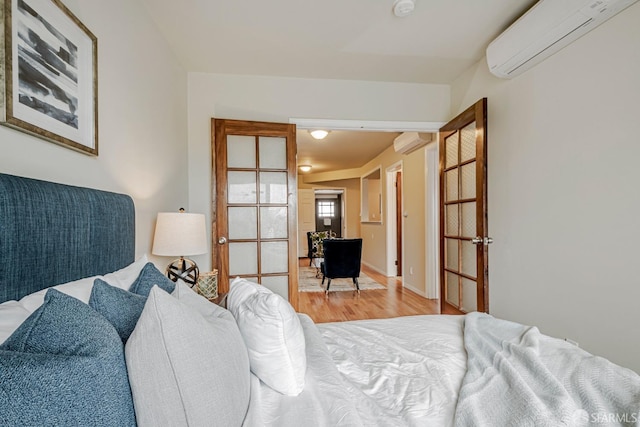 2375 31st Ave, San Francisco, CA 94116 - bedroom featuring a wall mounted air conditioner and wood finished floors