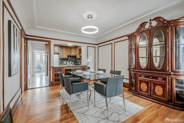 2375 31st Ave, San Francisco, CA 94116 - dining room with light wood-style flooring and a decorative wall