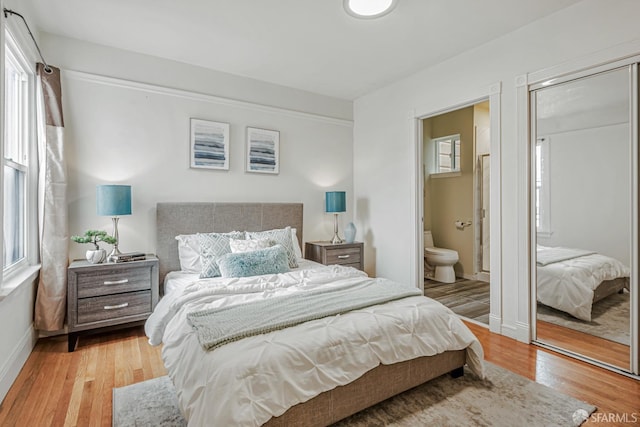 2375 31st Ave, San Francisco, CA 94116 - bedroom featuring baseboards, light wood-style flooring, and ensuite bathroom