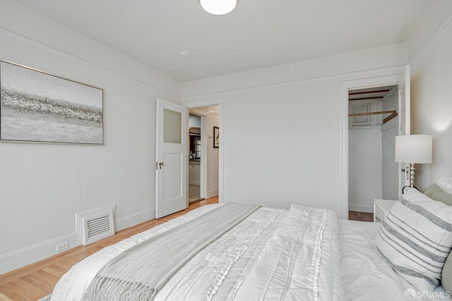 2375 31st Ave, San Francisco, CA 94116 - bedroom featuring a closet, wood finished floors, and visible vents