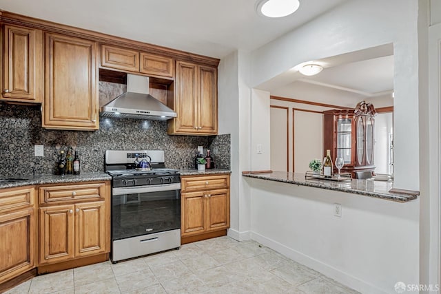 2375 31st Ave, San Francisco, CA 94116 - kitchen featuring stainless steel range with gas stovetop, stone counters, tasteful backsplash, and wall chimney range hood