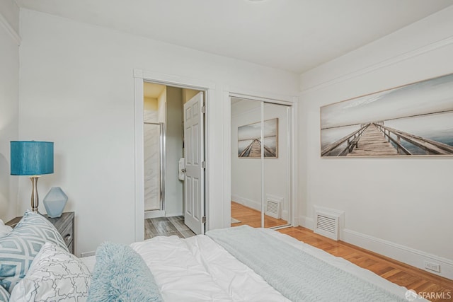 2375 31st Ave, San Francisco, CA 94116 - bedroom with baseboards, visible vents, wood finished floors, and a closet