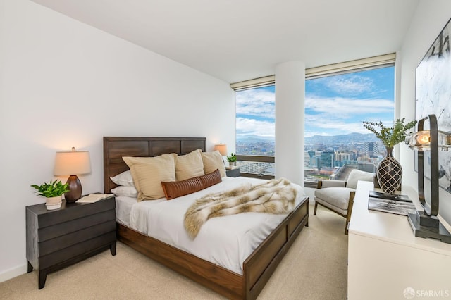 bedroom featuring light colored carpet