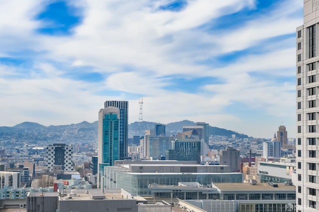 property's view of city featuring a mountain view