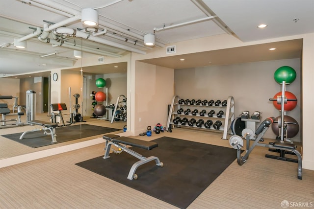 exercise room featuring visible vents, recessed lighting, and carpet floors