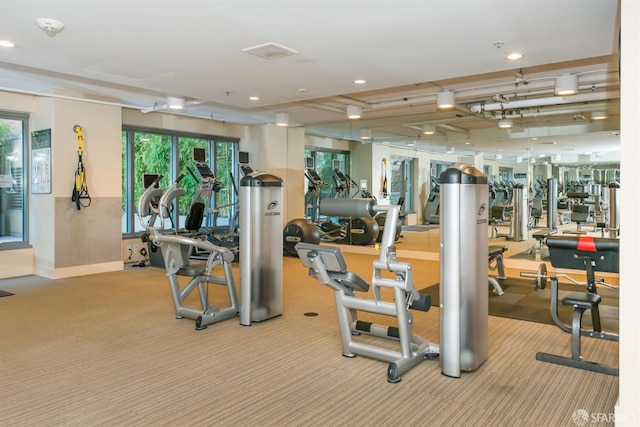 workout area with a wealth of natural light, carpet flooring, and recessed lighting