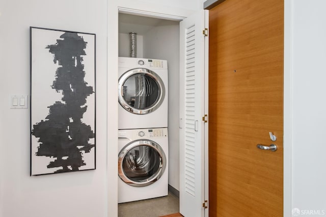 washroom with laundry area and stacked washing maching and dryer