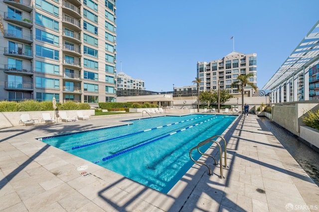 view of swimming pool with a patio area