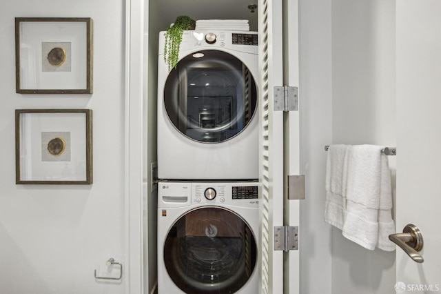 clothes washing area with stacked washer / drying machine