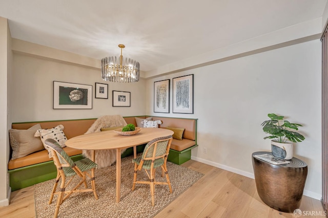 1177 California St Unit 212, San Francisco, CA 94108 - dining room featuring breakfast area, light wood-type flooring, and a chandelier