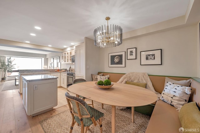 1177 California St Unit 212, San Francisco, CA 94108 - dining room featuring light wood-type flooring, recessed lighting, and a chandelier