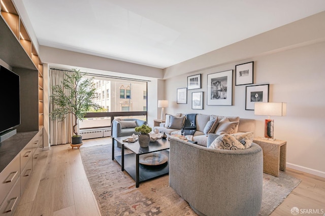 1177 California St Unit 212, San Francisco, CA 94108 - living area with light wood-type flooring and a baseboard heating unit