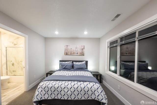 bedroom with carpet, recessed lighting, visible vents, ensuite bath, and baseboards