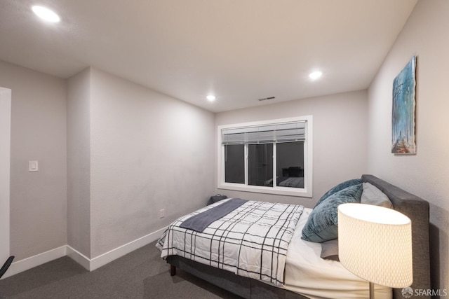 carpeted bedroom featuring recessed lighting, visible vents, and baseboards