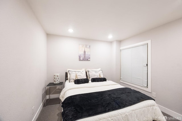 carpeted bedroom with recessed lighting and baseboards