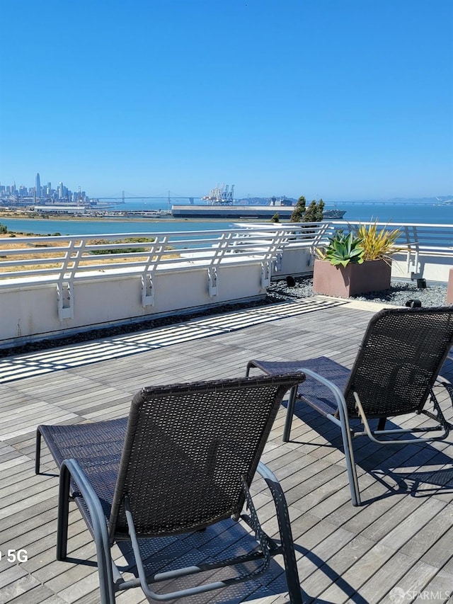 wooden terrace with a water view