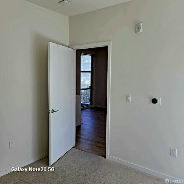 spare room with wood-type flooring