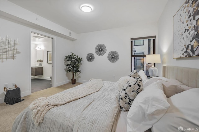 bedroom with carpet flooring and ensuite bathroom