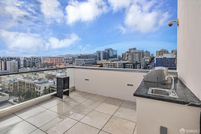 view of patio / terrace featuring a grill, exterior kitchen, and sink