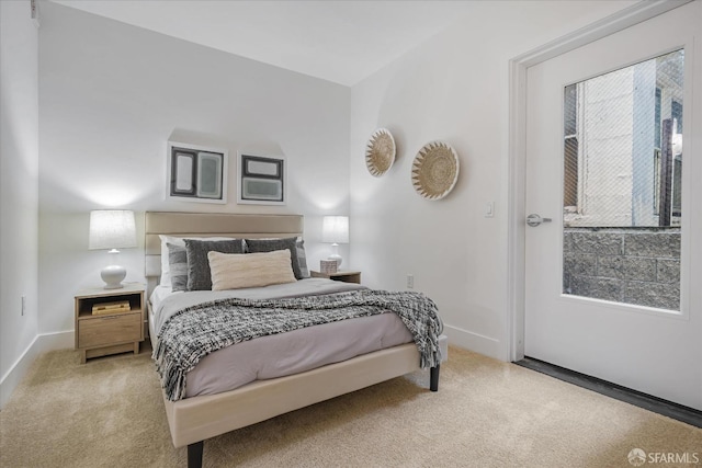 bedroom with multiple windows and carpet