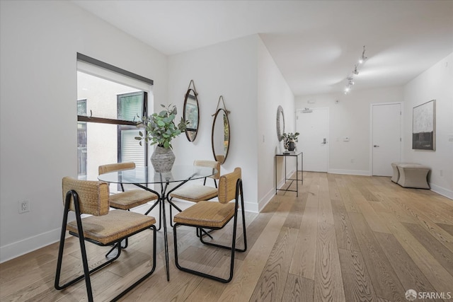 dining room with light hardwood / wood-style flooring