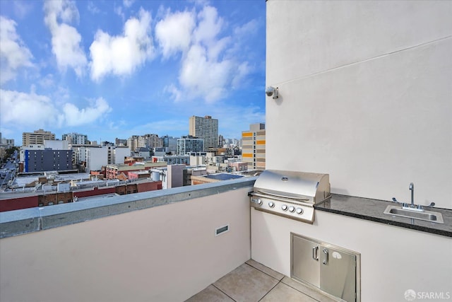 view of patio / terrace with area for grilling and sink