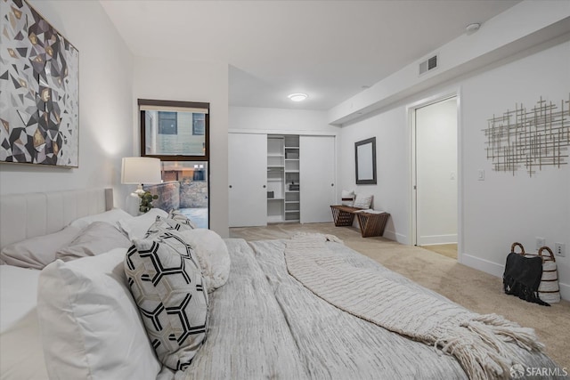 carpeted bedroom with a closet