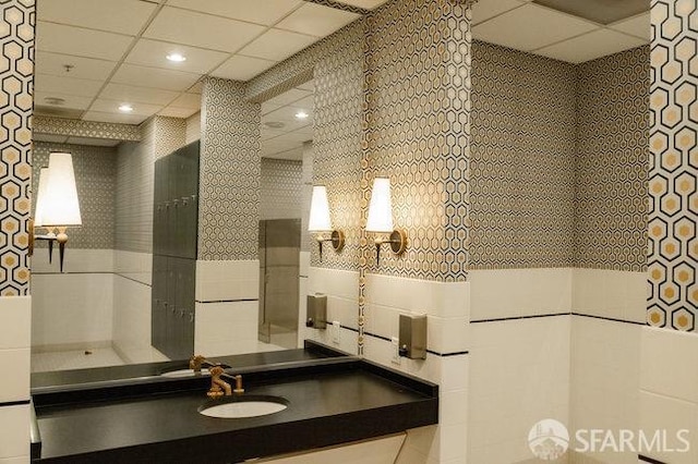 425 1st St Unit 1402, San Francisco, CA 94105 - bathroom featuring vanity, tile walls, a drop ceiling, and recessed lighting