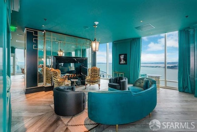 425 1st St Unit 1402, San Francisco, CA 94105 - living area featuring expansive windows, plenty of natural light, and a water view