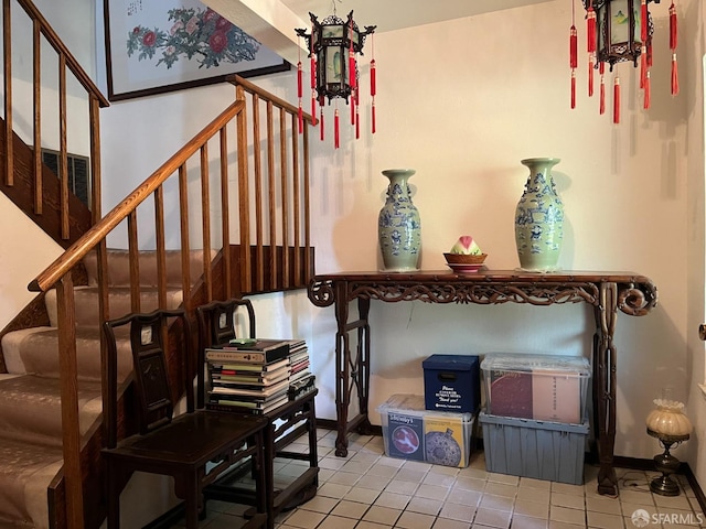 stairway featuring tile patterned floors