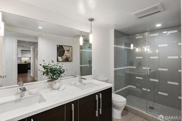 420 Mission Bay Blvd Unit 311, San Francisco, CA 94158 - bathroom featuring double vanity, a stall shower, recessed lighting, and tile patterned flooring