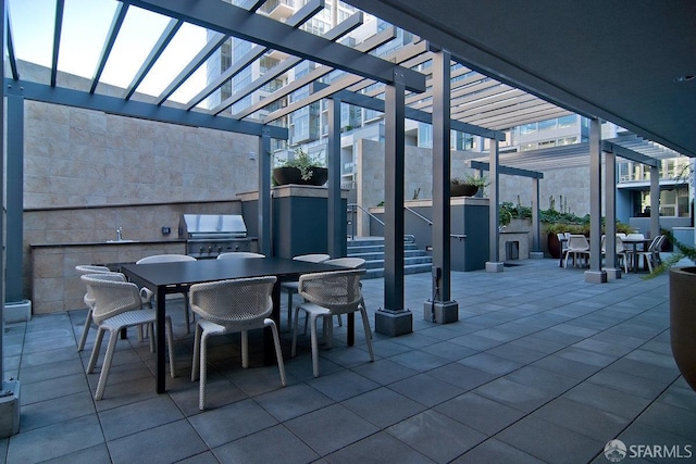 420 Mission Bay Blvd Unit 311, San Francisco, CA 94158 - view of patio with outdoor dining area, a pergola, and exterior kitchen