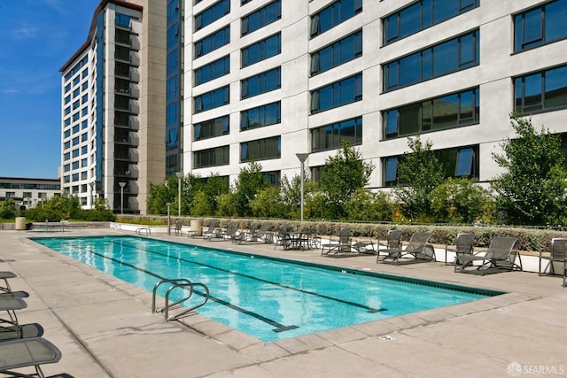 view of swimming pool featuring a patio area