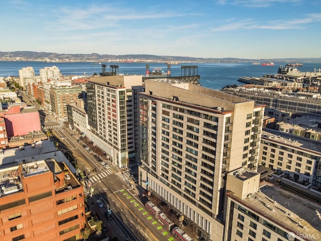 drone / aerial view featuring a water view and a city view