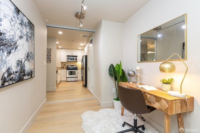 office with light wood-type flooring, visible vents, baseboards, and recessed lighting