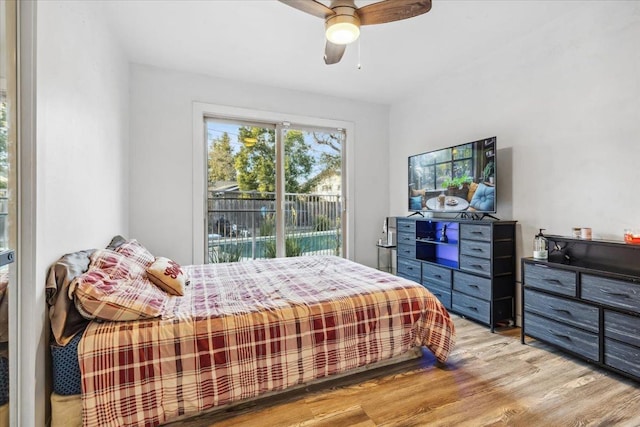 bedroom with ceiling fan, access to exterior, and light hardwood / wood-style flooring