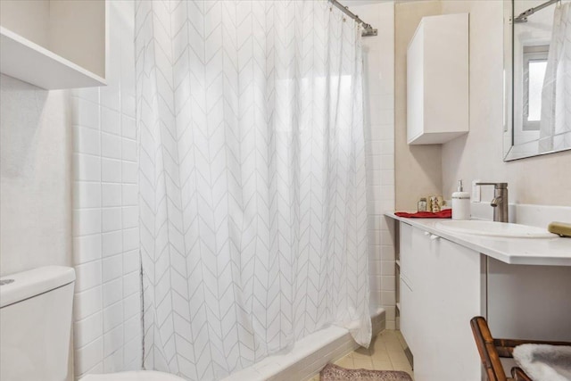 bathroom with tile patterned flooring, toilet, vanity, and a shower with shower curtain