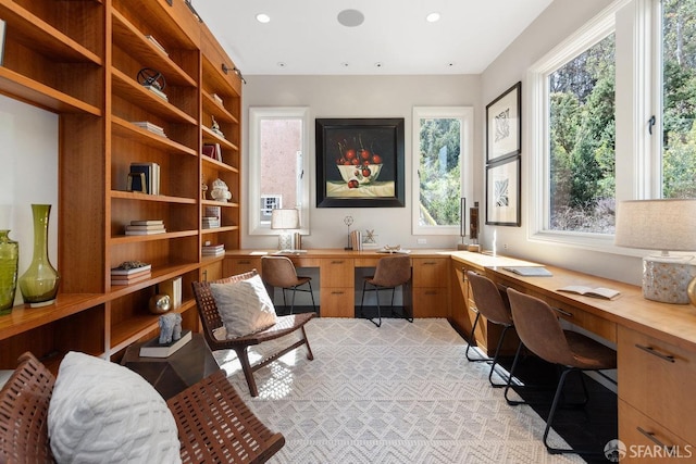 home office with recessed lighting and built in study area