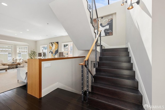 stairway with recessed lighting, baseboards, and hardwood / wood-style flooring