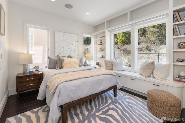 bedroom featuring recessed lighting, wood finished floors, and baseboards