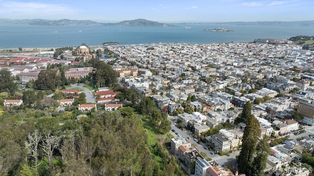 drone / aerial view with a residential view and a water and mountain view